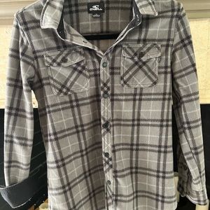 O’Neill flannel button down shirt can be worn as shirt or jacket. Snap buttons.